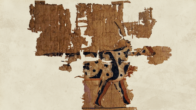 Fragmentarischer Papyrus, auf dem das Vorderteil eines schwarz-weiß gefleckten Rind mit rotbraunen Beinen erhalten ist, das nach rechts schreitet.
