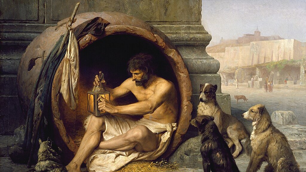 Der nur mit einem Tuch um die Hüften bekleidete Philosoph Diogenes sitzt in einem großen Krug, umringt von Hunden