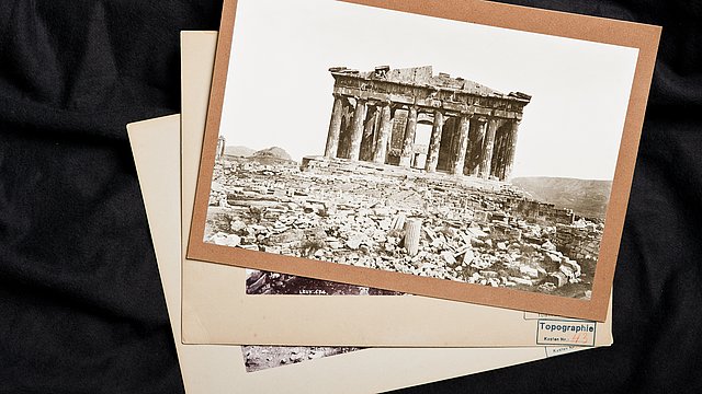 Photo: MUT | Valentin Marquardt Three vintage photographs on top of each other, with the upmost showing the ruin of a round ancient temple