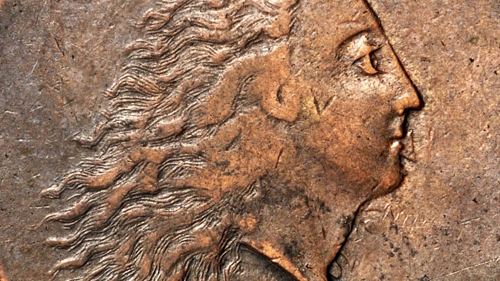 Foto: MUT Bildseite einer Kupfermünze mit einem nach rechts gewandtem Frauenkopf mit wehendem, offenem Haar; über dem Kopf ist der Schriftzug "LIBERTY", unter dem Kopf das Jahr 1793