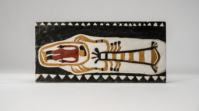 Photo: MUT | Valentin Marquardt Painted plaster cast propped up on its long side, showing a person enclosed by a line which in turn is grabbed by a giant crab