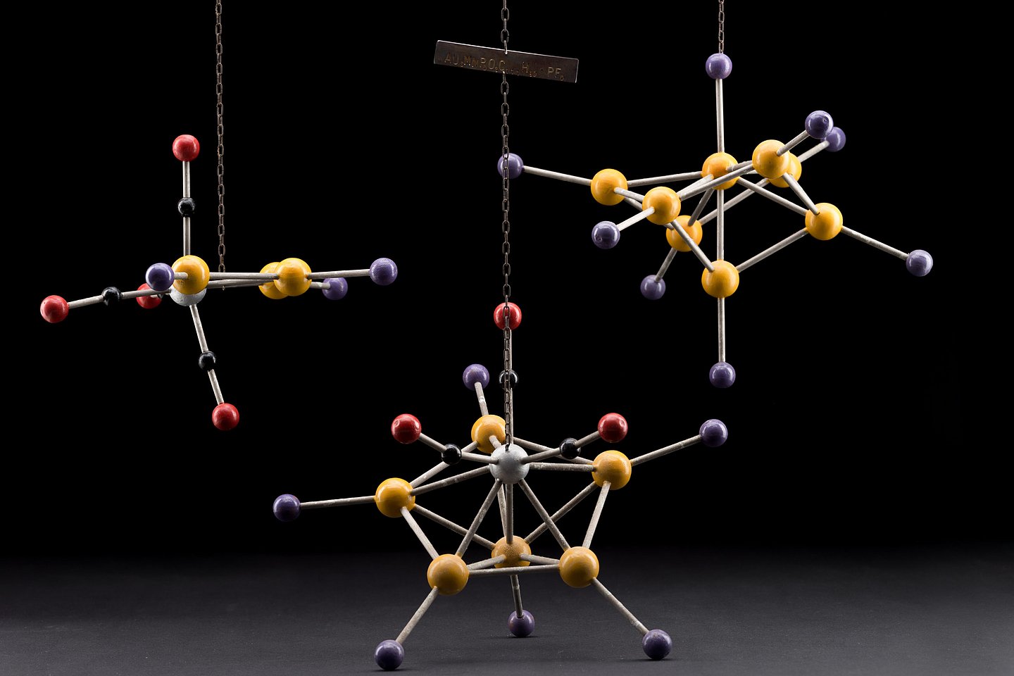 Molecular model of Au3Co made of colored painted wooden spheres of different sizes