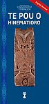 Wooden image of the Maori ancestress Hinematioro with the title "Te Pou o Hinematioro" in a white font, an interwoven traditional Maori pattern to the left and a red mark on the upper right corner "English version", all against blue background.