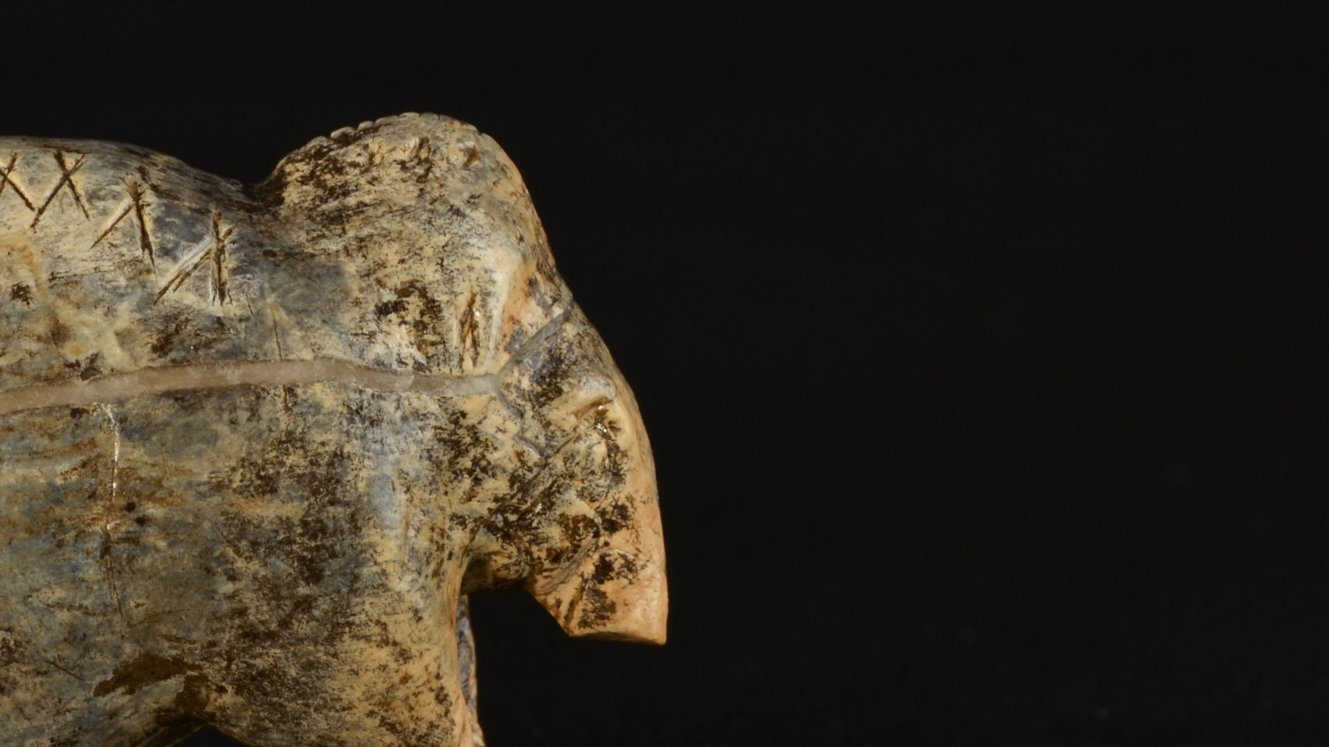 Mammoth figurine made out of mammoth ivory with the legs and trunk only preserved rudimentarily