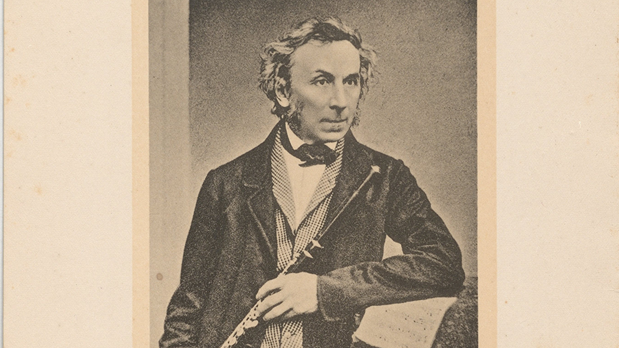 Photograph of the flutist, master flute maker and composer Theobalm Boehm with flute