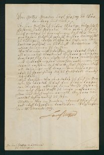 Fotografie eines alten handschriftlichen Dokuments auf leicht vergilbtem Papier. Der Text ist in deutscher Kurrentschrift oder einer ähnlichen historischen Schreibweise verfasst und erstreckt sich über die gesamte Seite. Am unteren Rand befindet sich eine Unterschrift. Das Dokument ist von einem dunklen Rahmen umgeben.