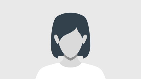 Very stilized depiction of a person's bust with dark, chin-length hair and a white shirt