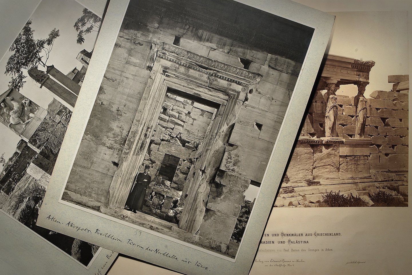 A stack of dark and red sepia photos  showing ancient Greek ruins