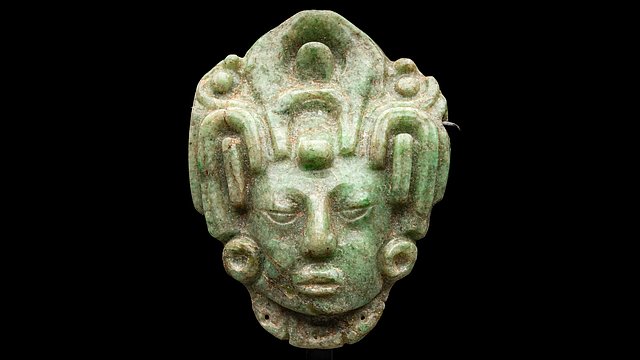 Pelling-Zarnitz Collection Green jade head of a Mayan maize god with headdress against a black background
